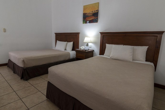 Imagen de la habitación del Hotel Cayman Suites, El Garit&oacute;n. Foto 13