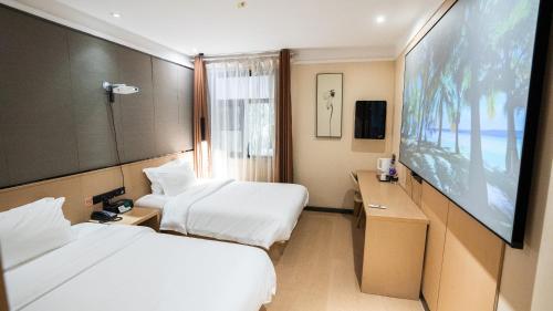 Imagen de la habitación del Hotel 海菲酒店 郑州高铁东站CbD国际会展中心店. Foto 13