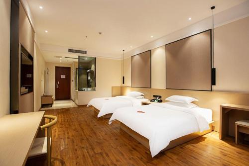 Imagen de la habitación del Hotel 海菲酒店 郑州高铁东站CbD国际会展中心店. Foto 16