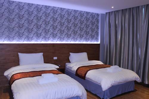 Imagen de la habitación del Hotel Cbd Suratthani. Foto 12