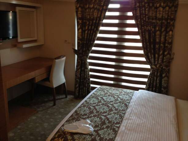 Imagen de la habitación del Hotel Cebeciler Otel. Foto 14