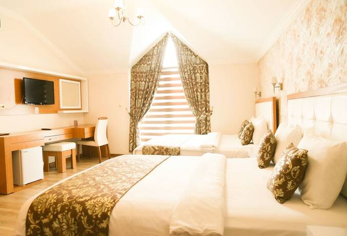 Imagen de la habitación del Hotel Cebeciler Otel. Foto 15