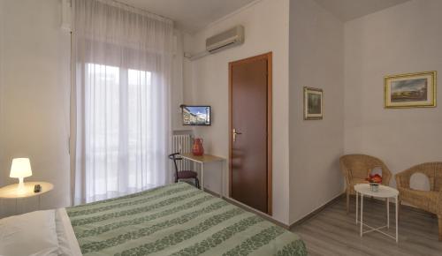 Imagen de la habitación del Hotel Cecile, Pisa. Foto 19