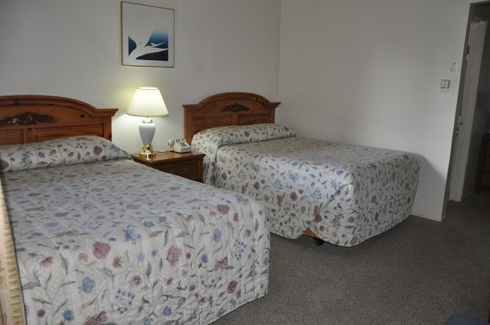 Imagen de la habitación del Hotel Cedar Inn and Suites. Foto 10