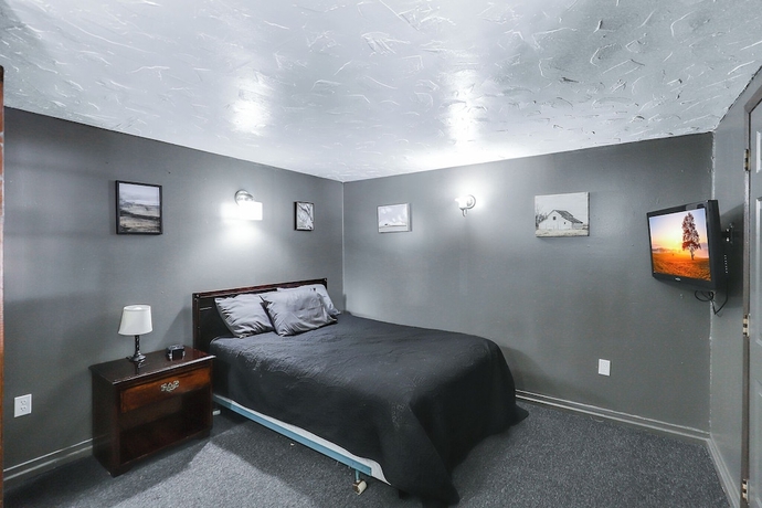 Imagen de la habitación del Hotel Cedar Village Motel. Foto 4