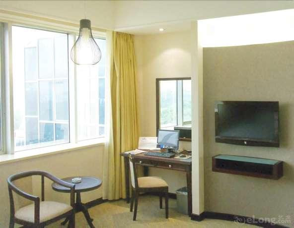 Imagen de la habitación del Hotel Celeste Palace International Hotel - Jiangmen. Foto 14