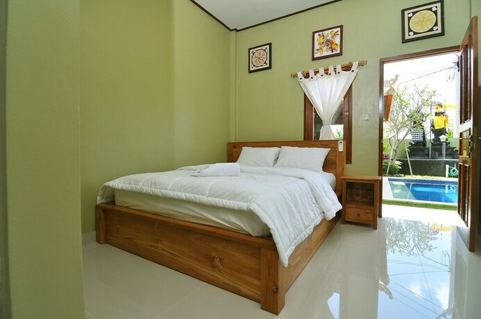 Imagen de la habitación del Hotel Cempaka Mas Guesthouse. Foto 22
