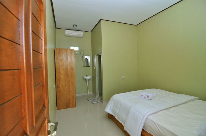 Imagen de la habitación del Hotel Cempaka Mas Guesthouse. Foto 23
