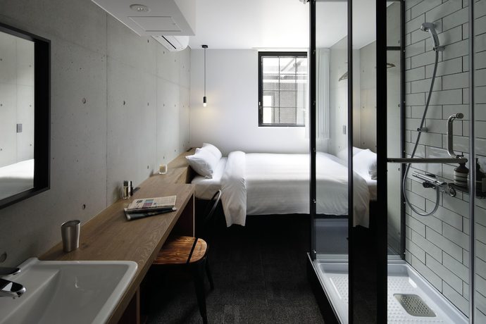 Imagen de la habitación del Hotel Cen. Foto 16