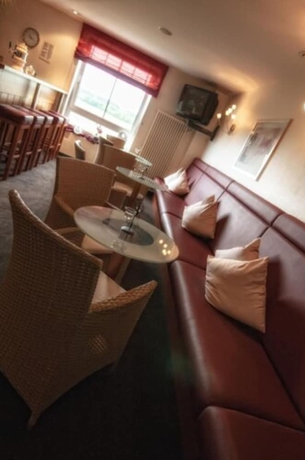 Imagen del bar/restaurante del Hotel Center Drive Inn. Foto 7