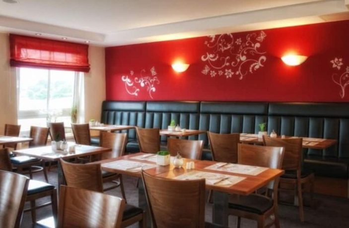 Imagen del bar/restaurante del Hotel Center Drive Inn. Foto 8