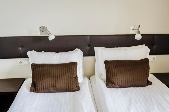 Imagen de la habitación del Hotel Center Hotels Plaza. Foto 6