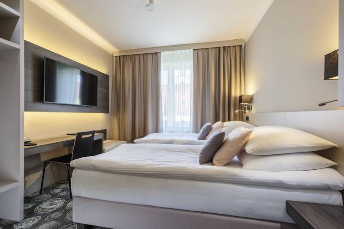 Imagen de la habitación del Hotel Center, Novo Mesto. Foto 17