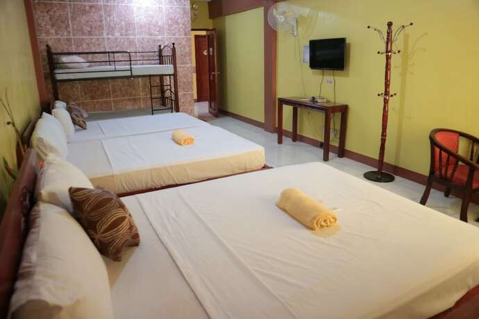 Imagen de la habitación del Hotel Centillo Travellers Inn. Foto 17