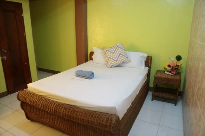 Imagen de la habitación del Hotel Centillo Travellers Inn. Foto 19