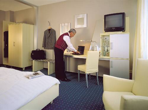 Imagen de la habitación del Hotel Central, Frankenthal. Foto 11