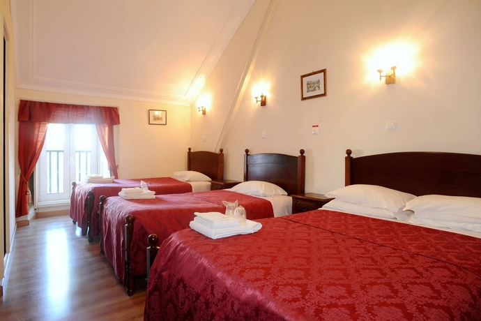 Imagen de la habitación del Hotel Central Guest House, Figueira da Foz. Foto 6