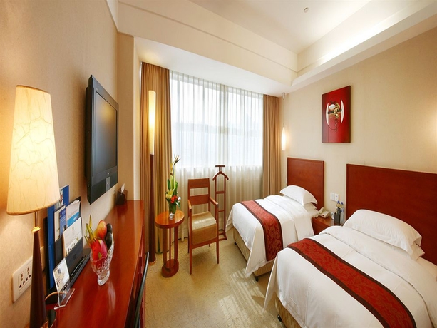 Imagen de la habitación del Hotel Central Jingmin. Foto 11