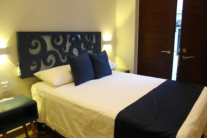 Imagen de la habitación del Hotel Centrico House. Foto 4