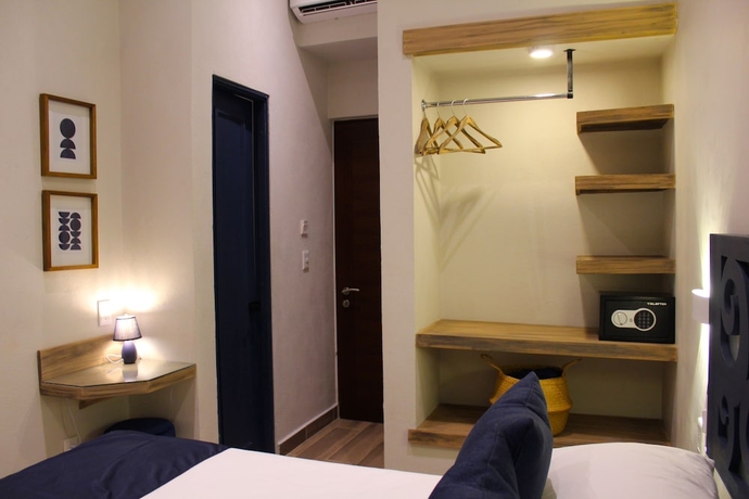 Imagen de la habitación del Hotel Centrico House. Foto 6