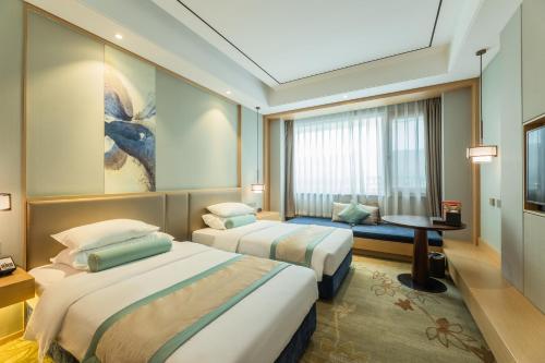 Imagen de la habitación del Hotel Century Runhua. Foto 14
