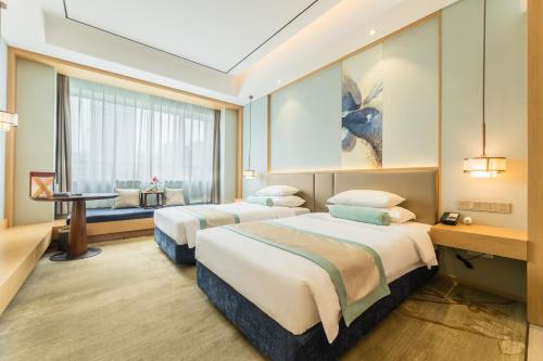 Imagen de la habitación del Hotel Century Runhua. Foto 17