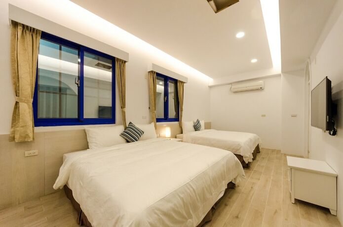 Imagen de la habitación del Hotel C\'est La Vie Villa. Foto 16