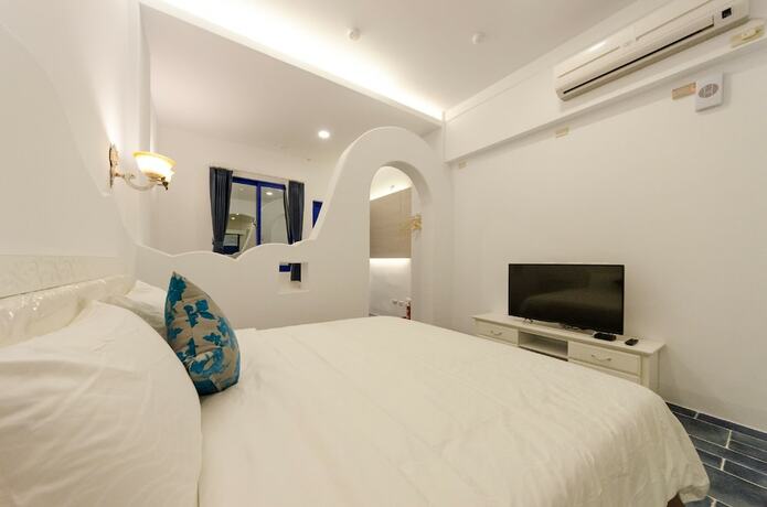 Imagen de la habitación del Hotel C\'est La Vie Villa. Foto 19