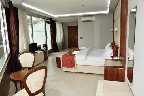 Imagen de la habitación del Hotel Cevaher & Suıtes. Foto 13