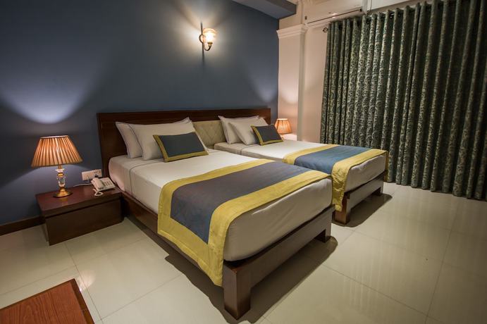 Imagen de la habitación del Hotel Ceyloni City. Foto 5