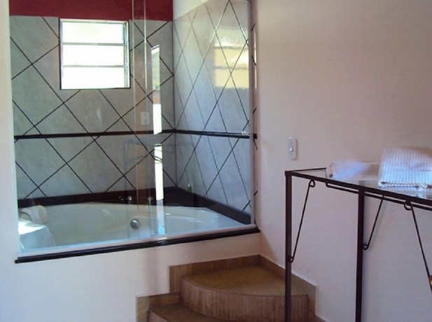 Imagen de la habitación del Hotel Chal&eacute;s Pousada Encantos da Serra. Foto 19