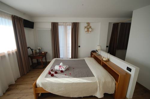 Imagen de la habitación del Hotel Chalet Fiocco Di Neve. Foto 16