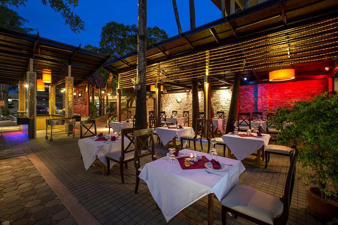 Imagen del bar/restaurante del Hotel Chanalai Flora Resort, Kata Beach. Foto 2