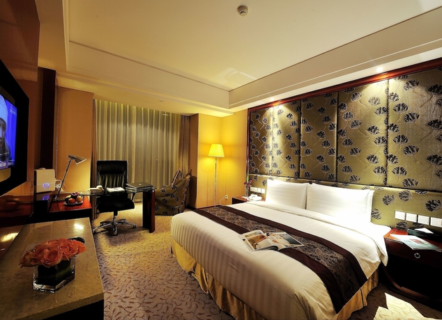 Imagen de la habitación del Hotel Changchun Ramada. Foto 9