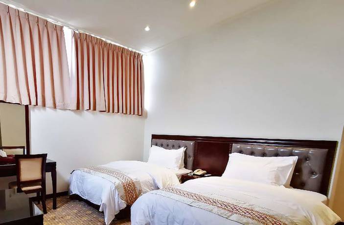 Imagen de la habitación del Hotel Changhong. Foto 6