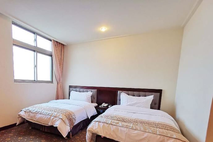Imagen de la habitación del Hotel Changhong. Foto 8