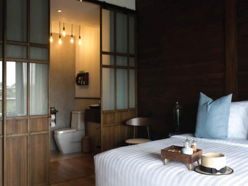 Imagen de la habitación del Hotel Chann Bangkok Noi. Foto 7