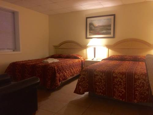 Imagen de la habitación del Hotel Charlee Villas By The Beach. Foto 11