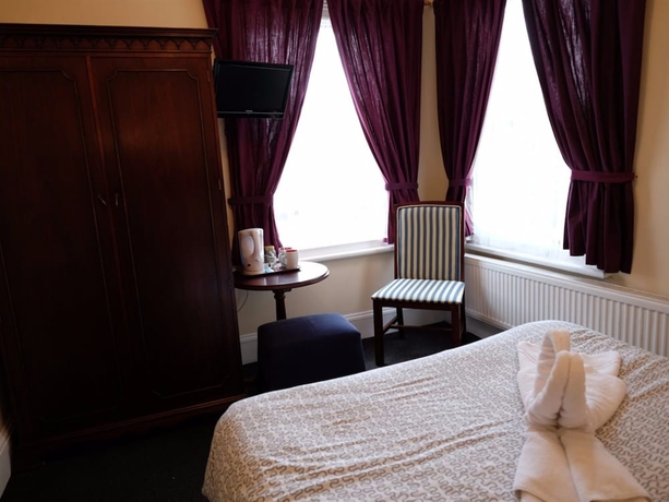 Imagen de la habitación del Hotel Charlotte Guest House. Foto 11