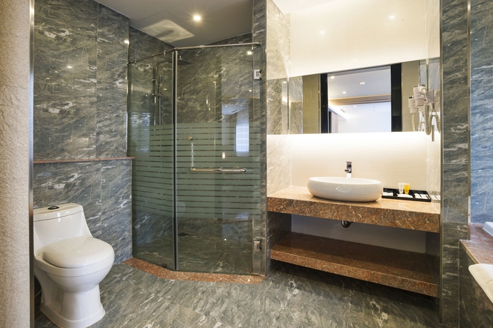 Imagen de la habitación del Hotel Charm Suite Saigon. Foto 10