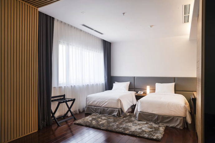 Imagen de la habitación del Hotel Charm Suite Saigon. Foto 11