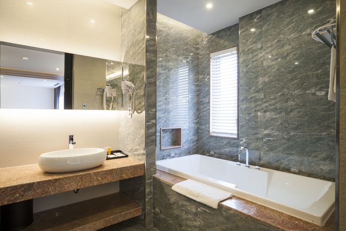 Imagen de la habitación del Hotel Charm Suite Saigon. Foto 12