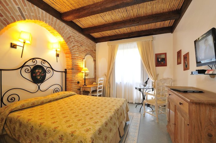 Imagen de la habitación del Hotel Charme La Bitta. Foto 3