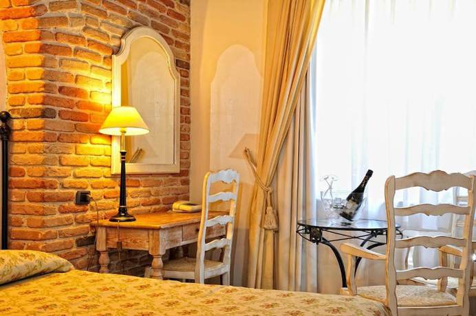 Imagen de la habitación del Hotel Charme La Bitta. Foto 8