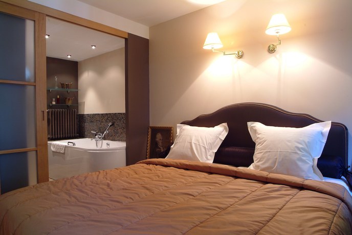 Imagen de la habitación del Hotel Charmehotel Manoir Ogygia. Foto 2