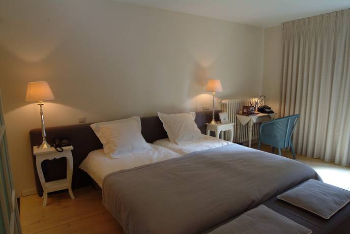 Imagen de la habitación del Hotel Charmehotel Manoir Ogygia. Foto 3
