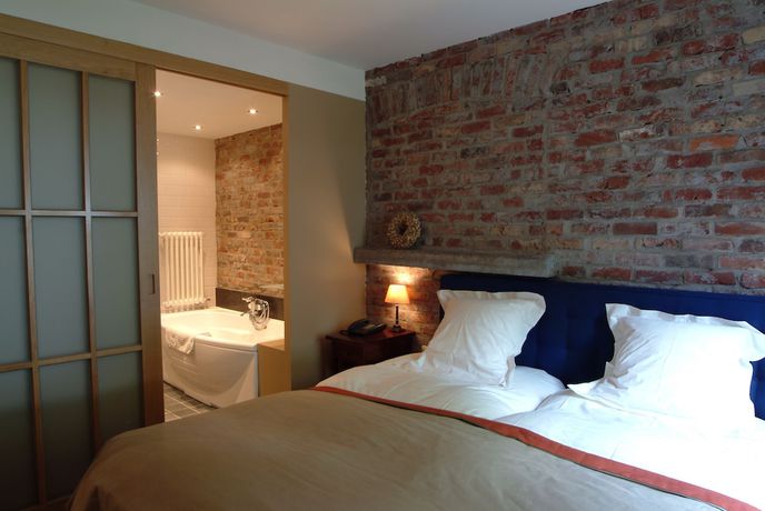 Imagen de la habitación del Hotel Charmehotel Manoir Ogygia. Foto 4