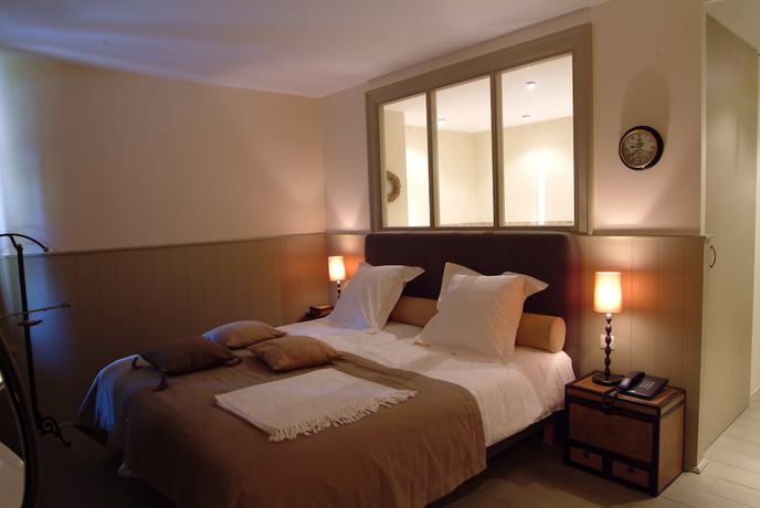 Imagen de la habitación del Hotel Charmehotel Manoir Ogygia. Foto 5
