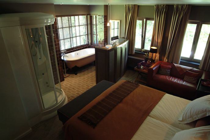 Imagen de la habitación del Hotel Charmehotel Manoir Ogygia. Foto 8