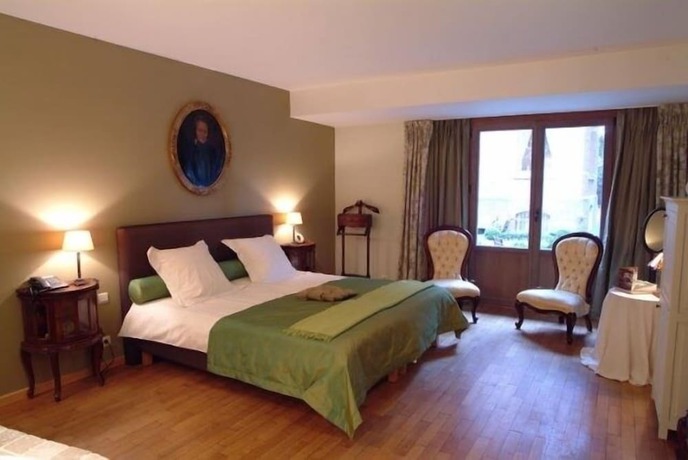 Imagen de la habitación del Hotel Charmehotel Manoir Ogygia. Foto 9